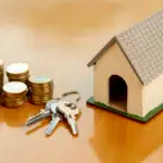 toy-model-house-piles-coins-front-view